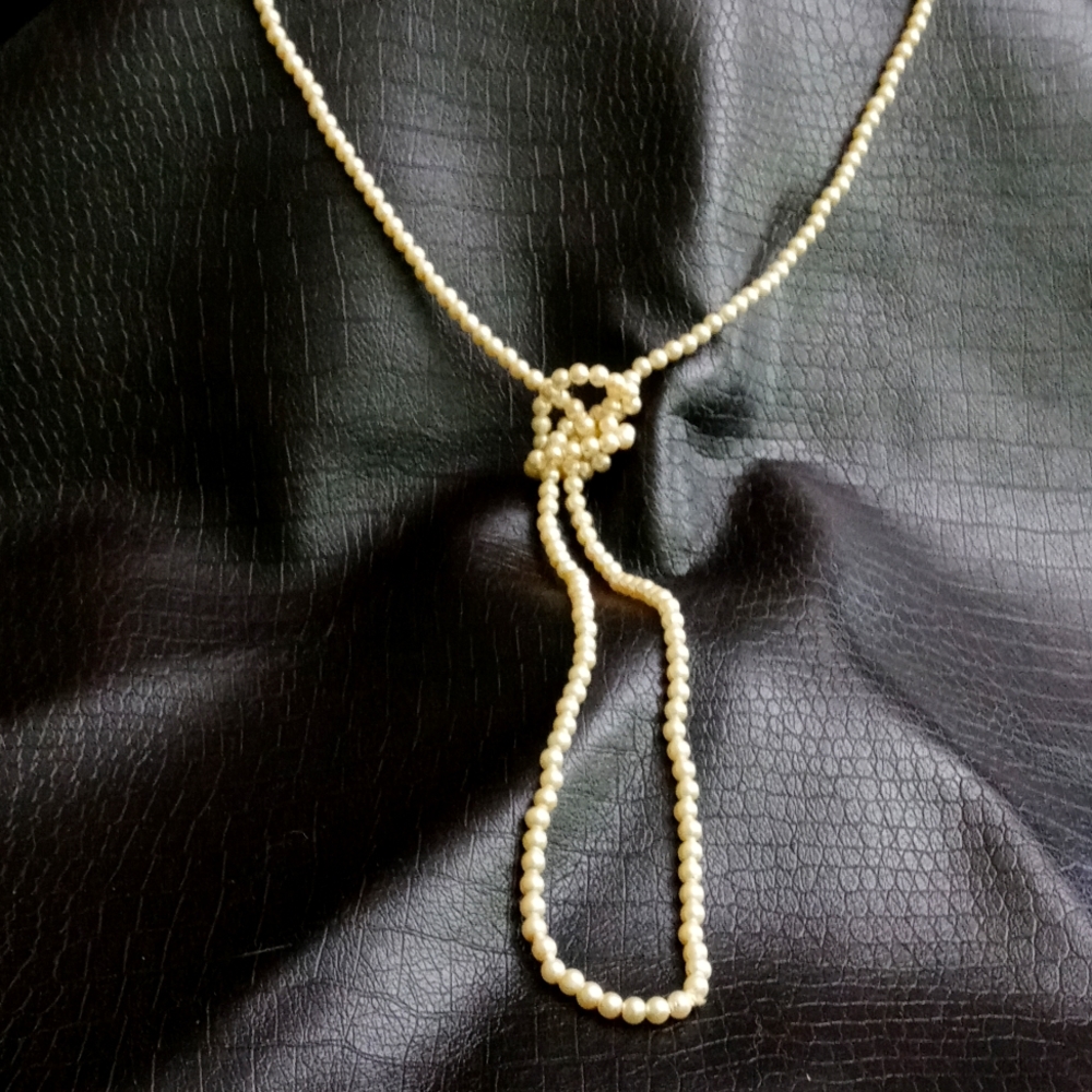 Long strand faux pearl strand